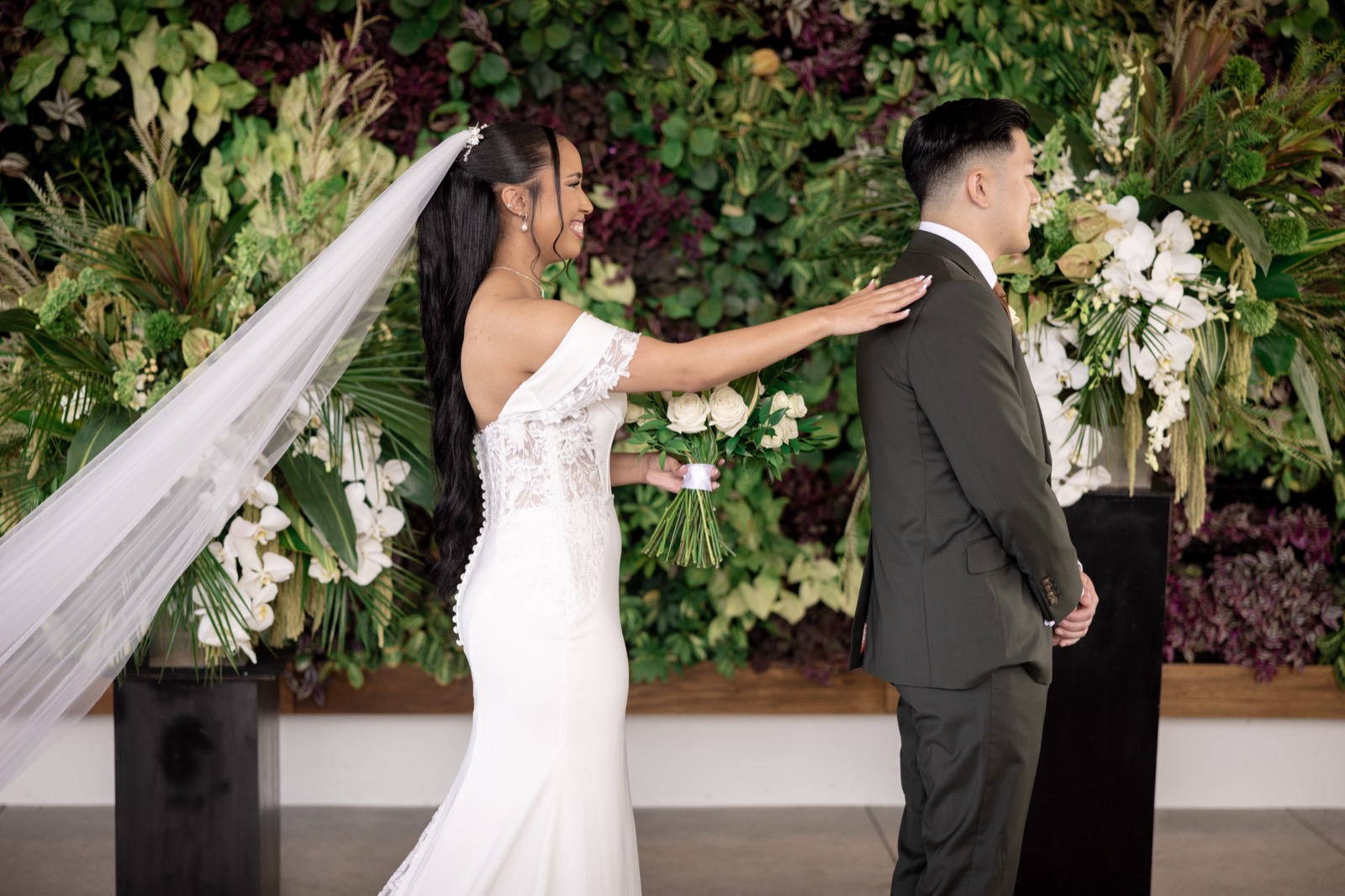 Rachel smiling in her bridal robe during getting ready at The Colony House wedding