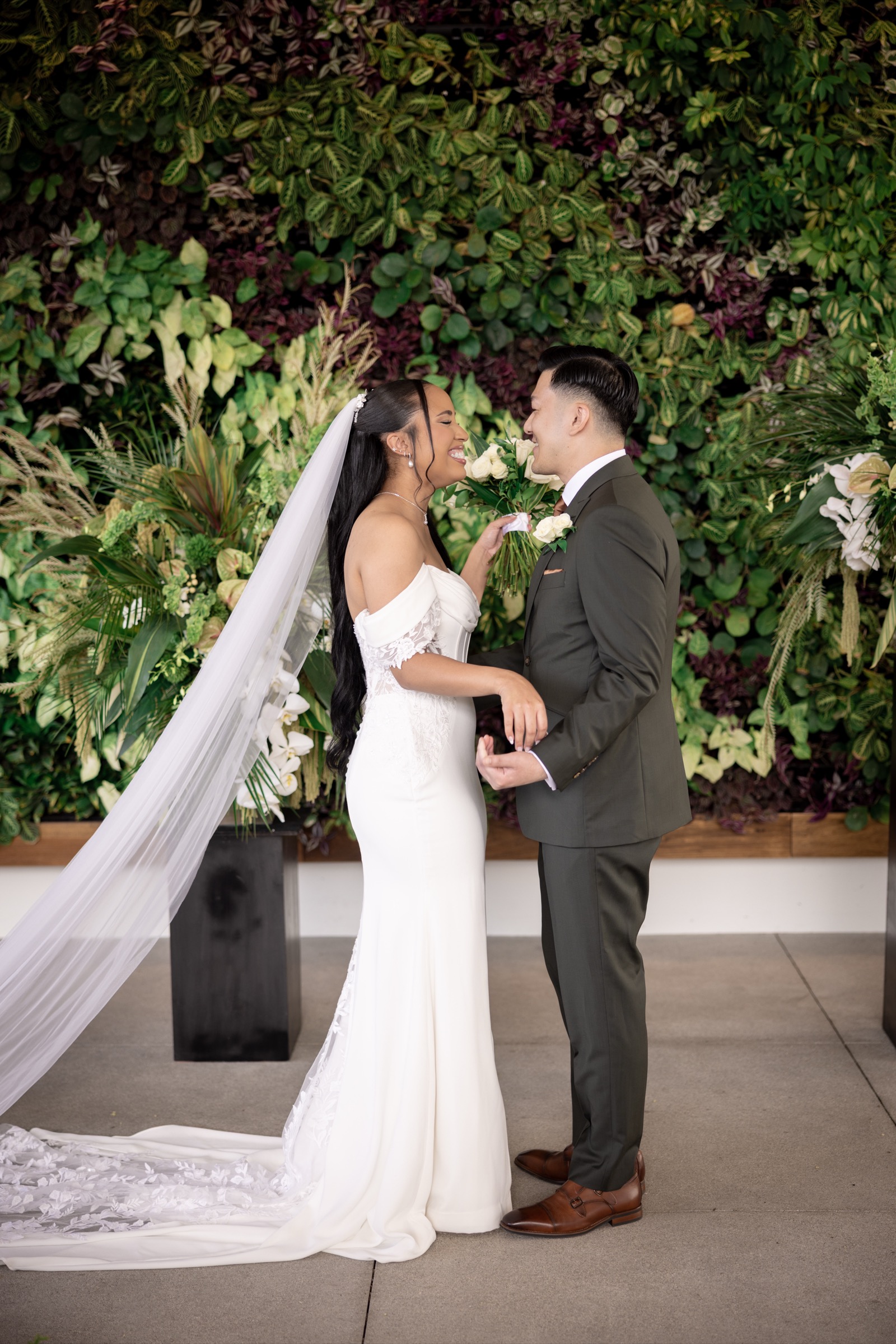 Rachel putting on her earrings during getting ready at The Colony House