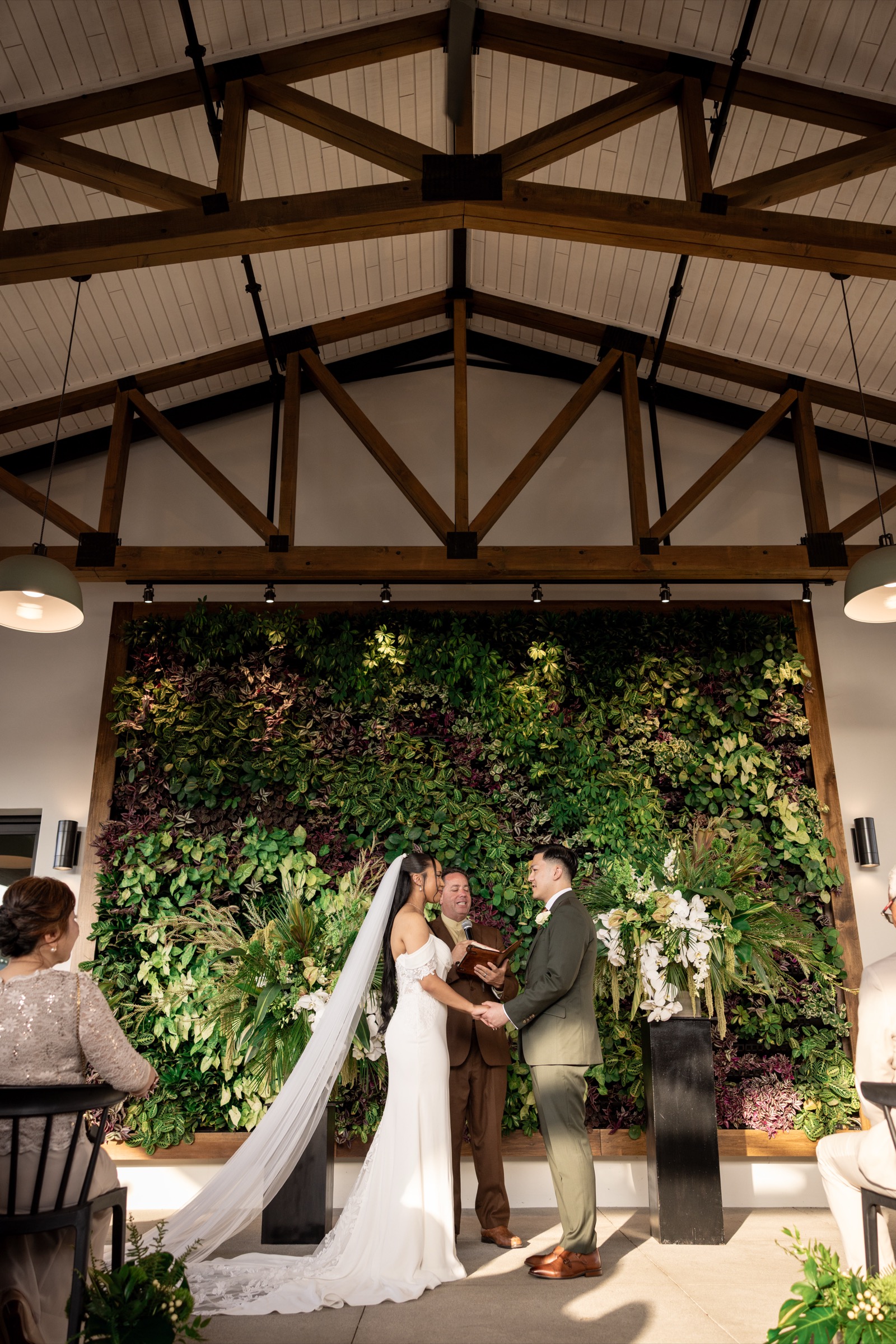 Rachel smiling behind Kevin during first look at The Colony House