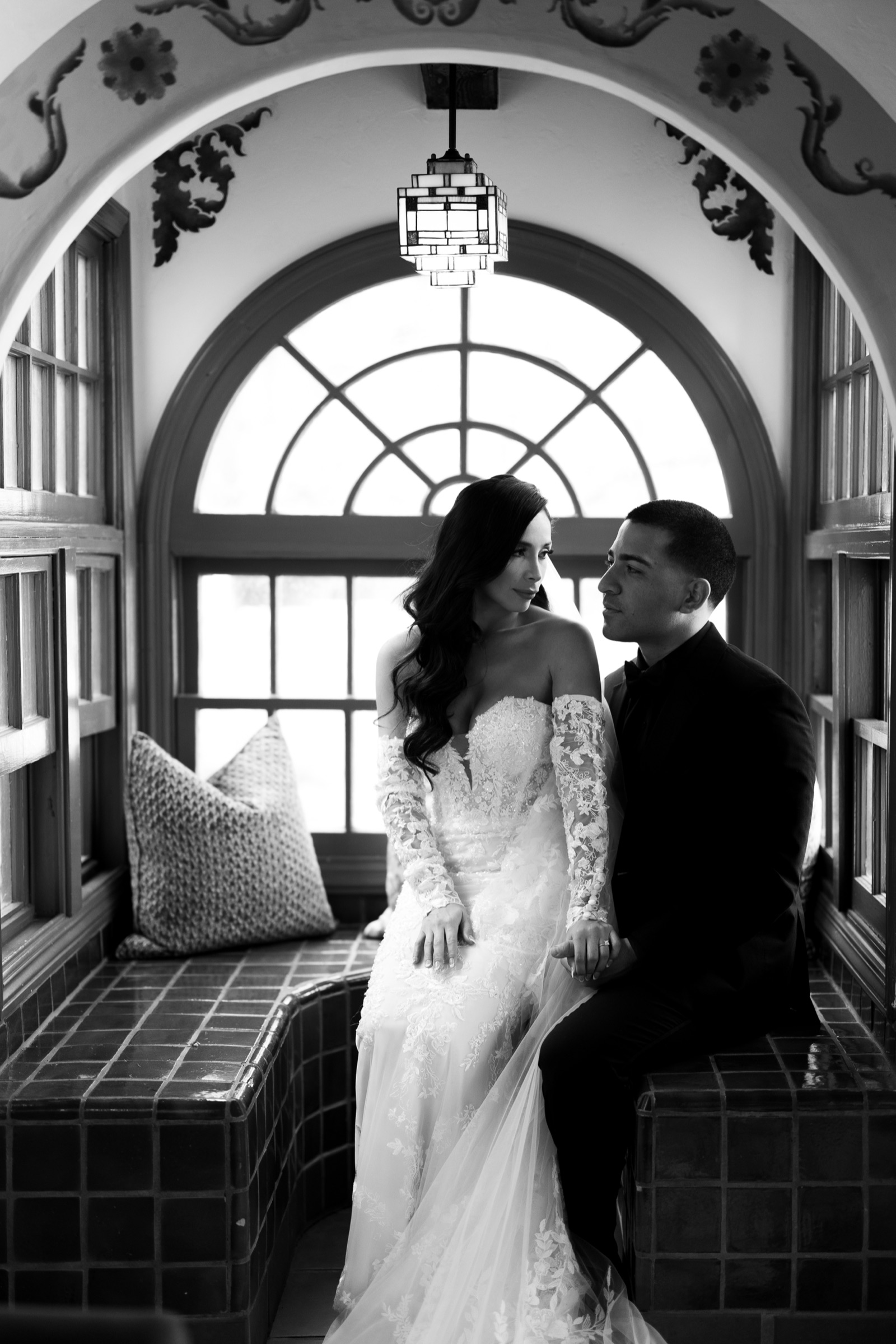 Black and white couple portrait in the arched alcove at Rancho Las Lomas