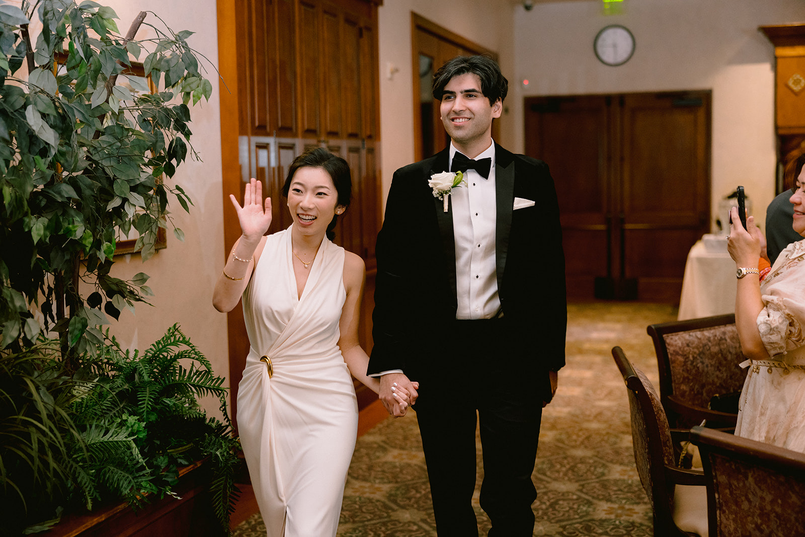 Couple entering the reception at South Hills Country Club ballroom