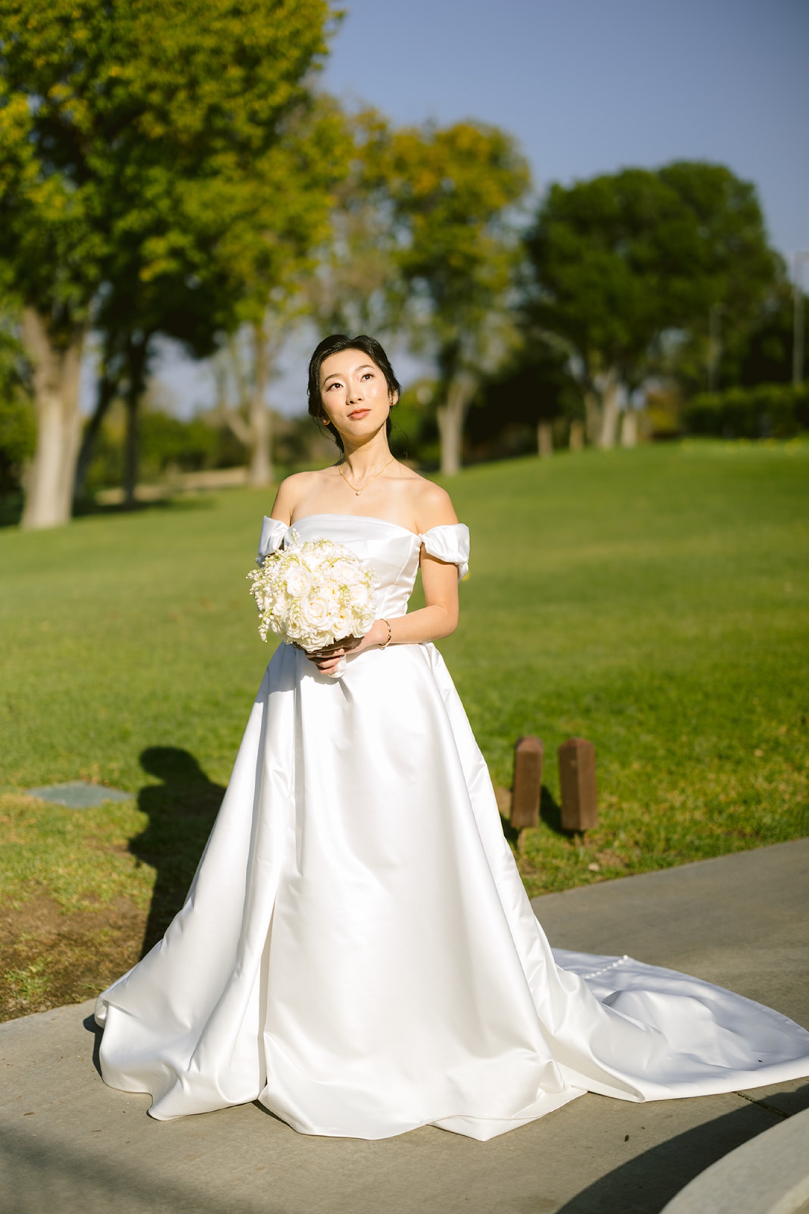Bride portrait on the golf course with bouquet