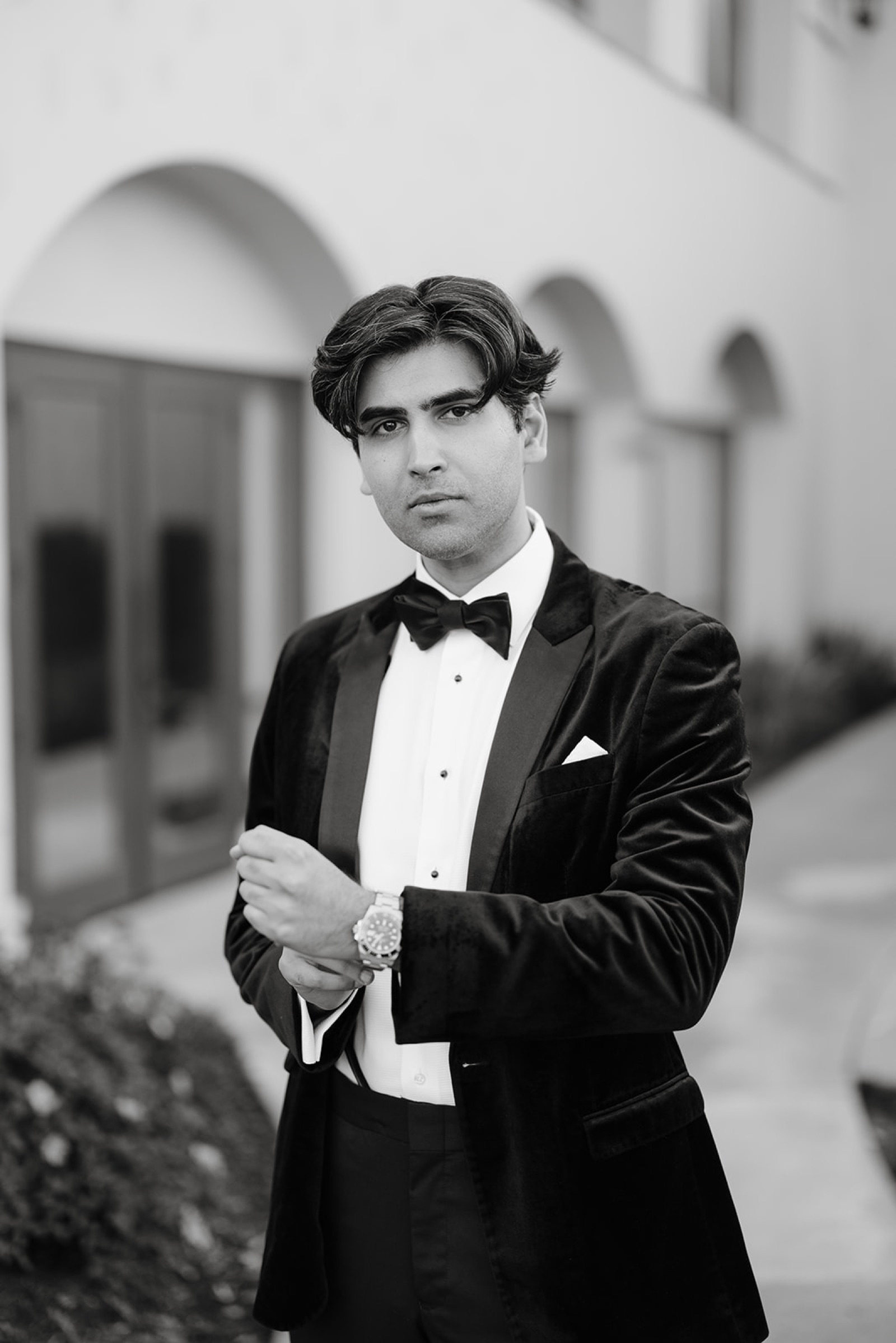 Black and white portrait of the groom