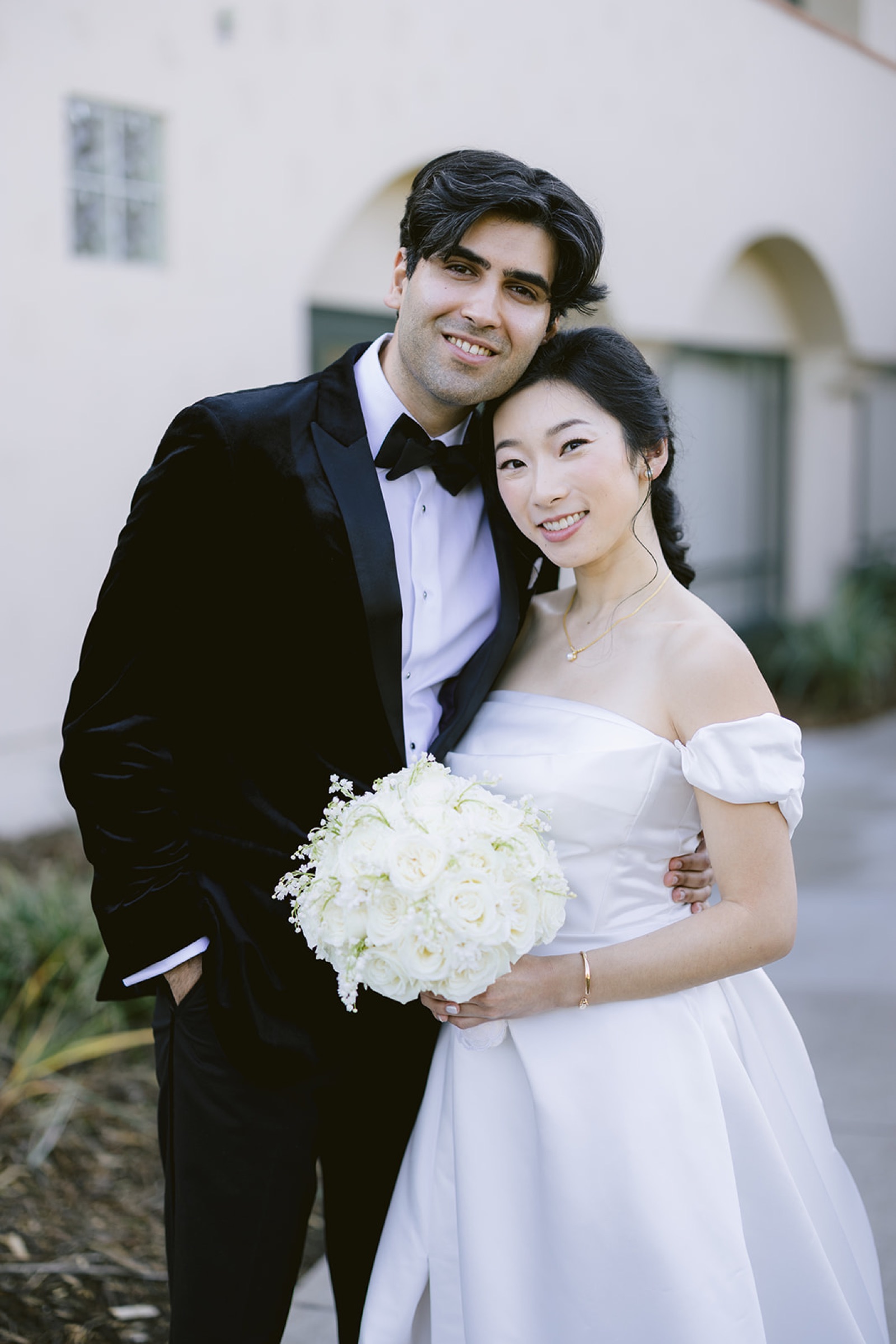 Kirsten and Shravan walking together after first look